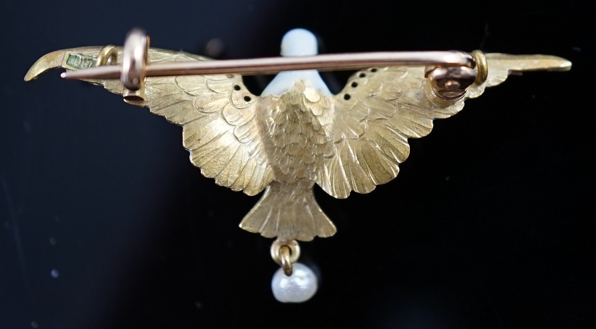 An early to mid 20th century 18ct gold, enamel, rose cut diamond and baroque pearl drop set brooch, modelled as a dove in flight